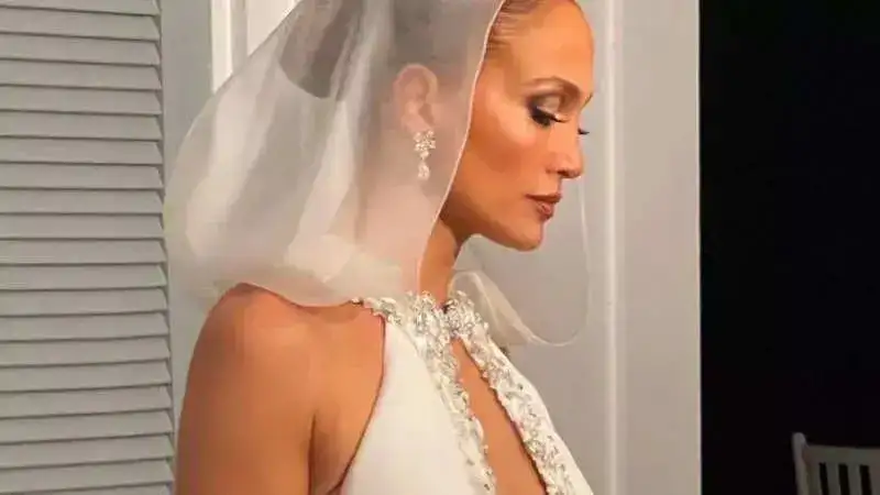 Jennifer Lopez shares the first look of her wedding gown. Take a look!