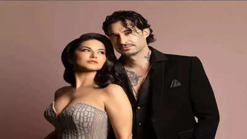 Sunny Leone looks stunning in a silver gown with her ‘date,’ husband Daniel Weber