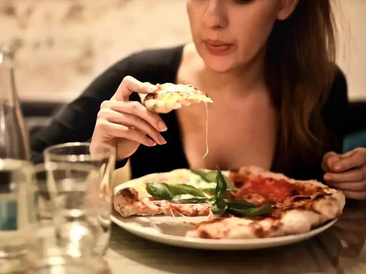 A girl eating pizza