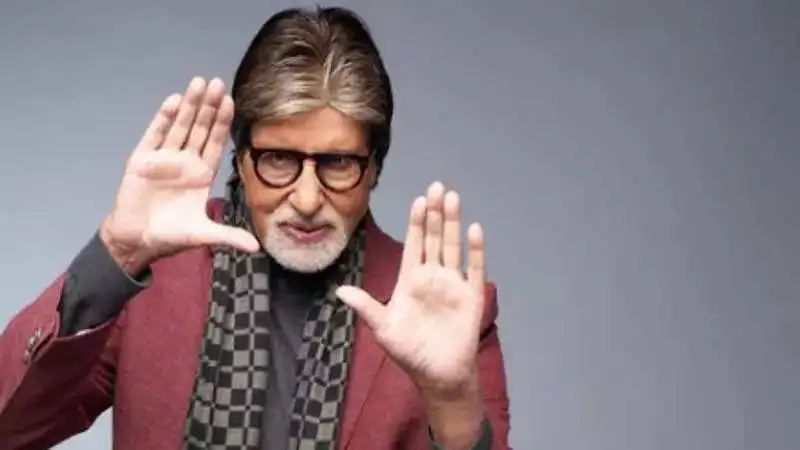 Shashikant Pedwal, a lookalike of Amitabh Bachchan, touches his feet to seek blessings