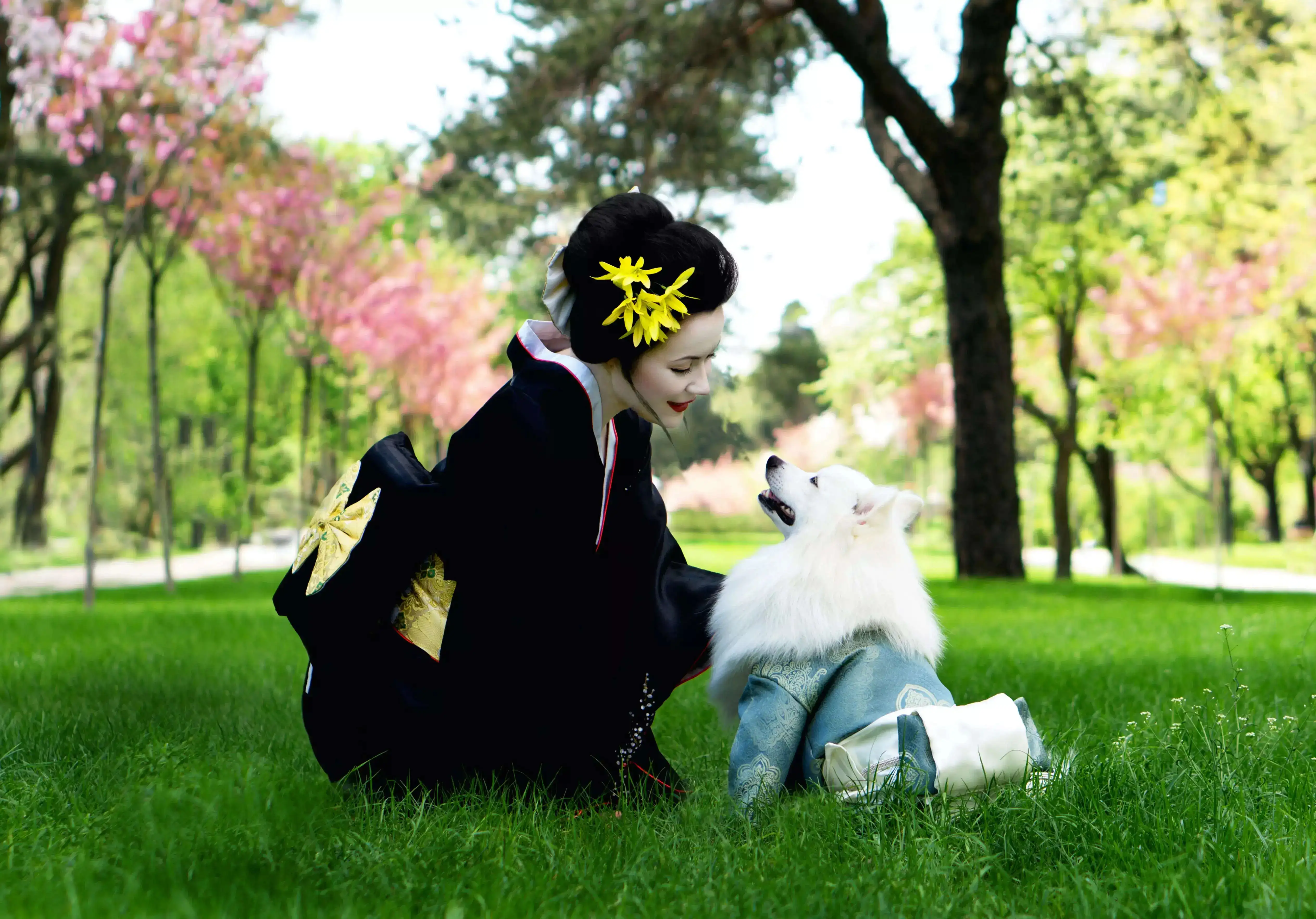 A Japanese girl playing with a dog