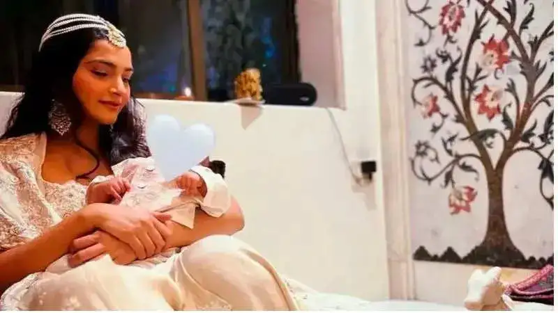 Rhea Kapoor shares precious picture of new mother, Sonam Kapoor cradling baby Vayu from her Diwali bash!