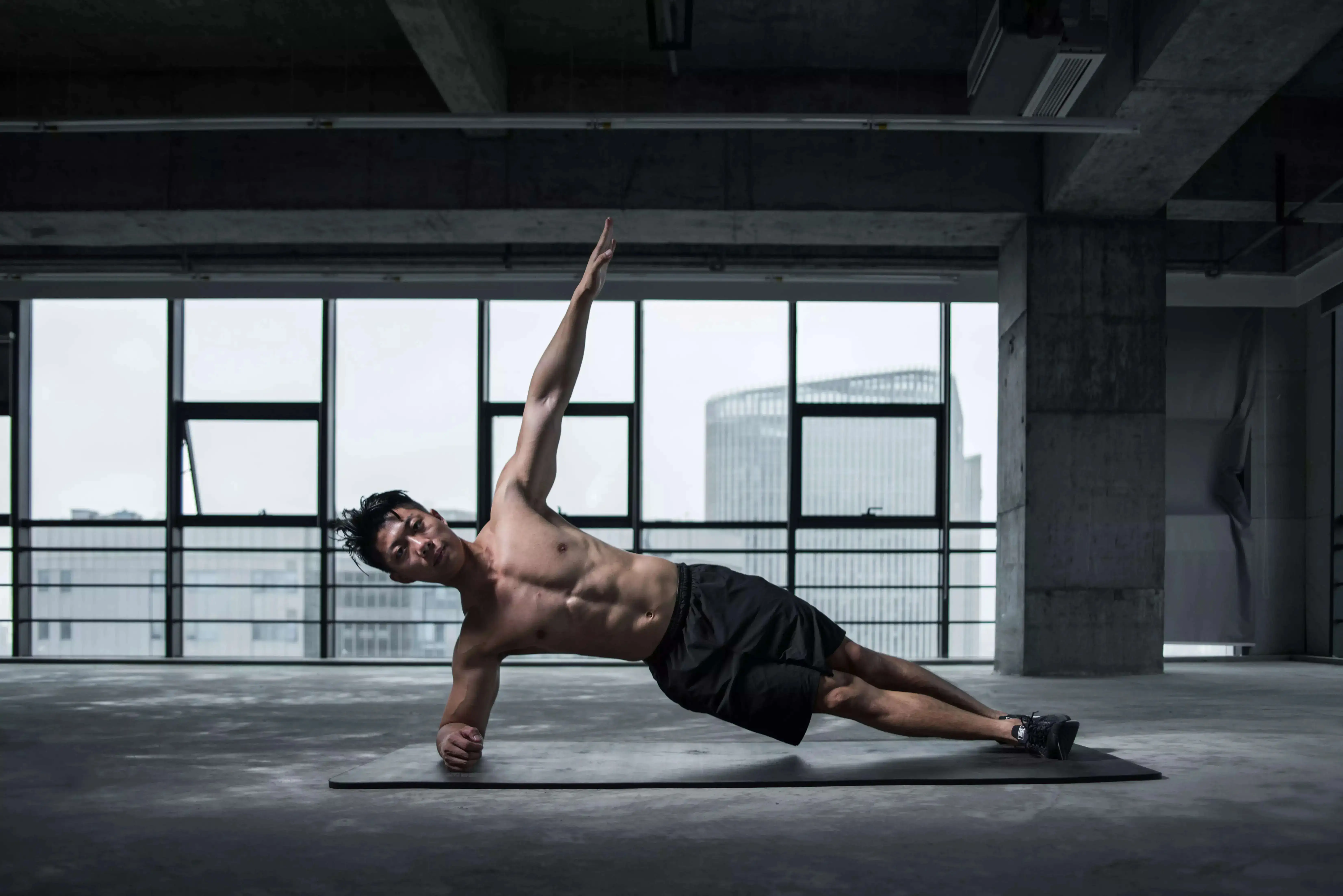 A man performing side planks