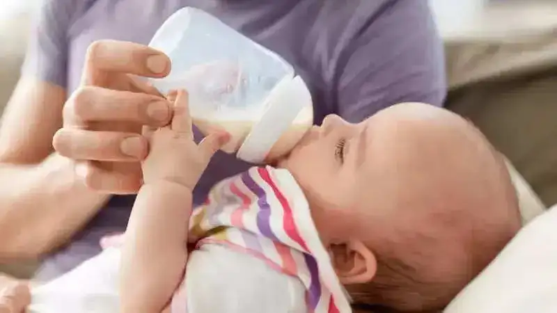 feeding baby with bottle