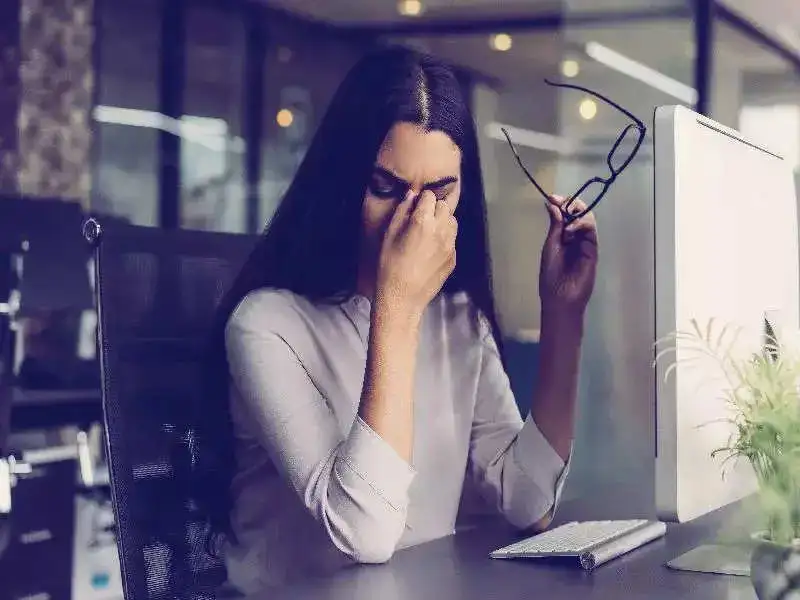 A worried girl sitting on chair