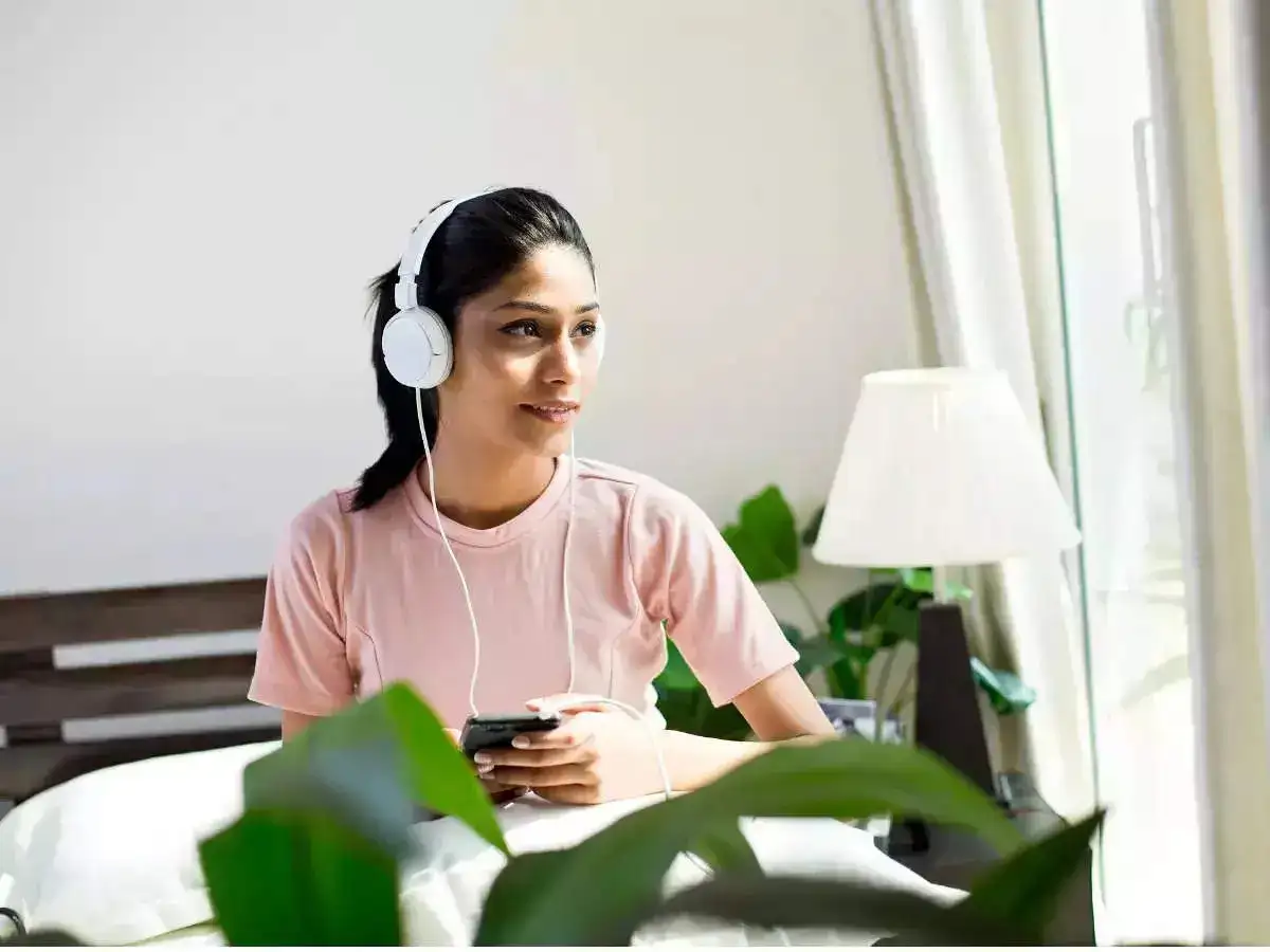 A girl listening to music on her headphones