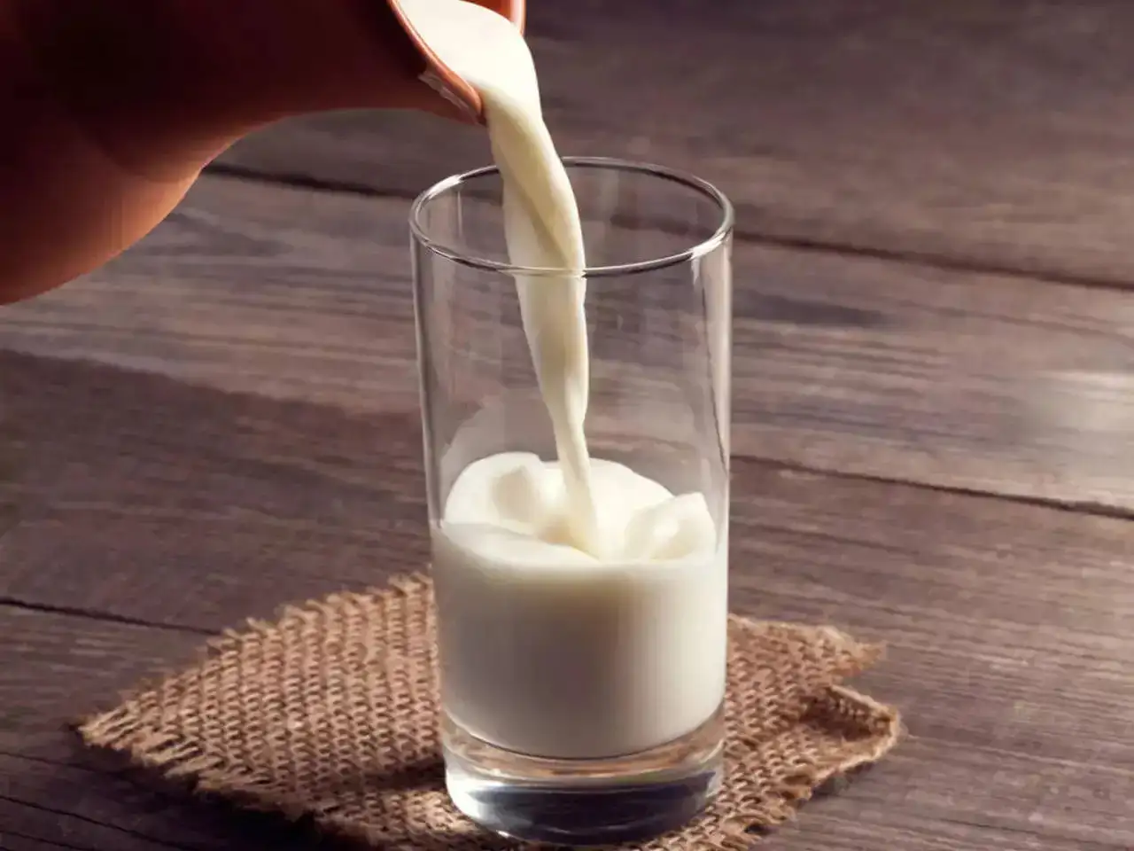 Milk being poured in a glass