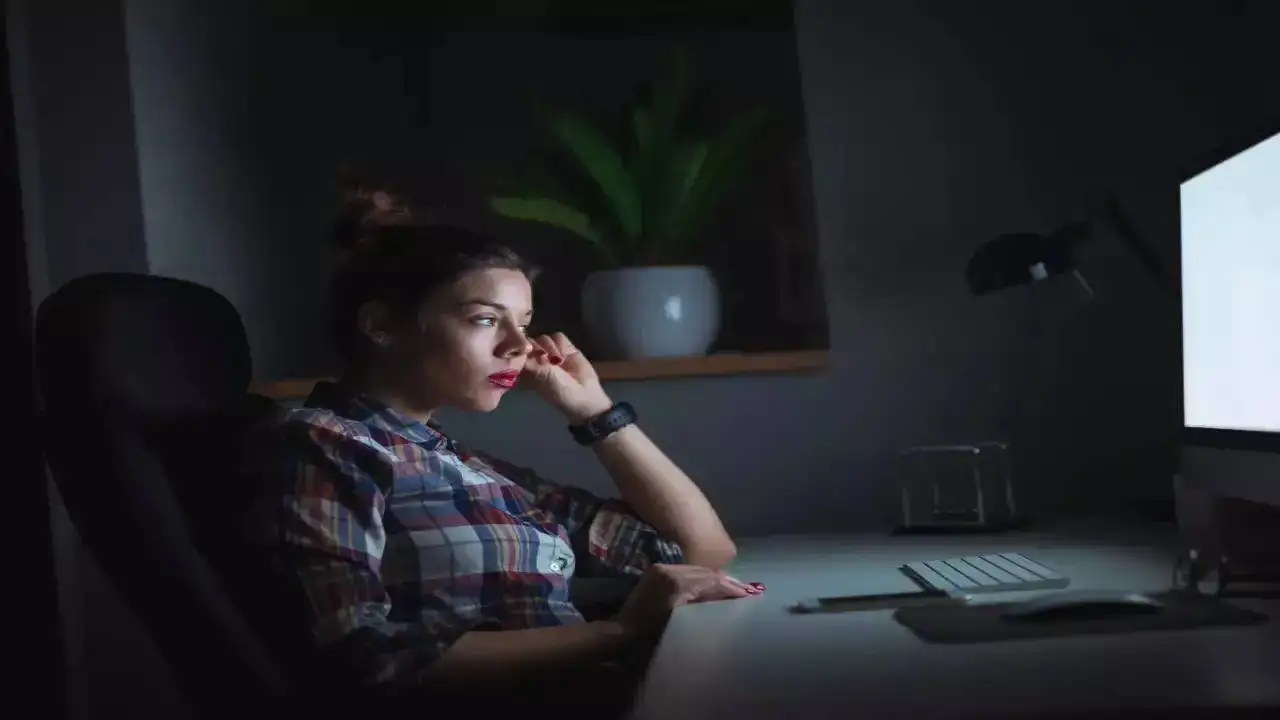 A girl looking at her desktop screen