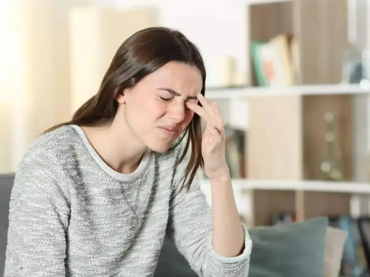 A woman itching her eyes