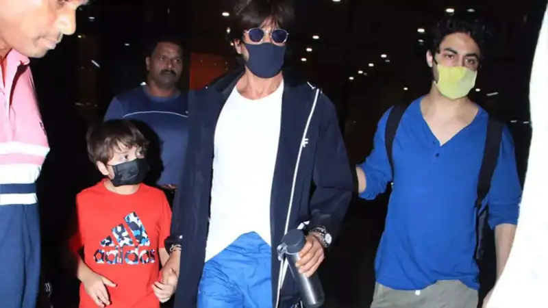 Aryan Khan shields his father Shah Rukh Khan as a fan tries to grab the actor for a selfie