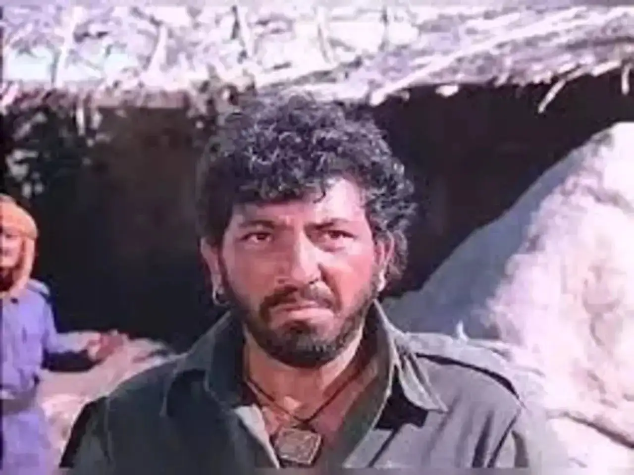 A still of Gabbar Singh played by Amjad Khan in Sholay