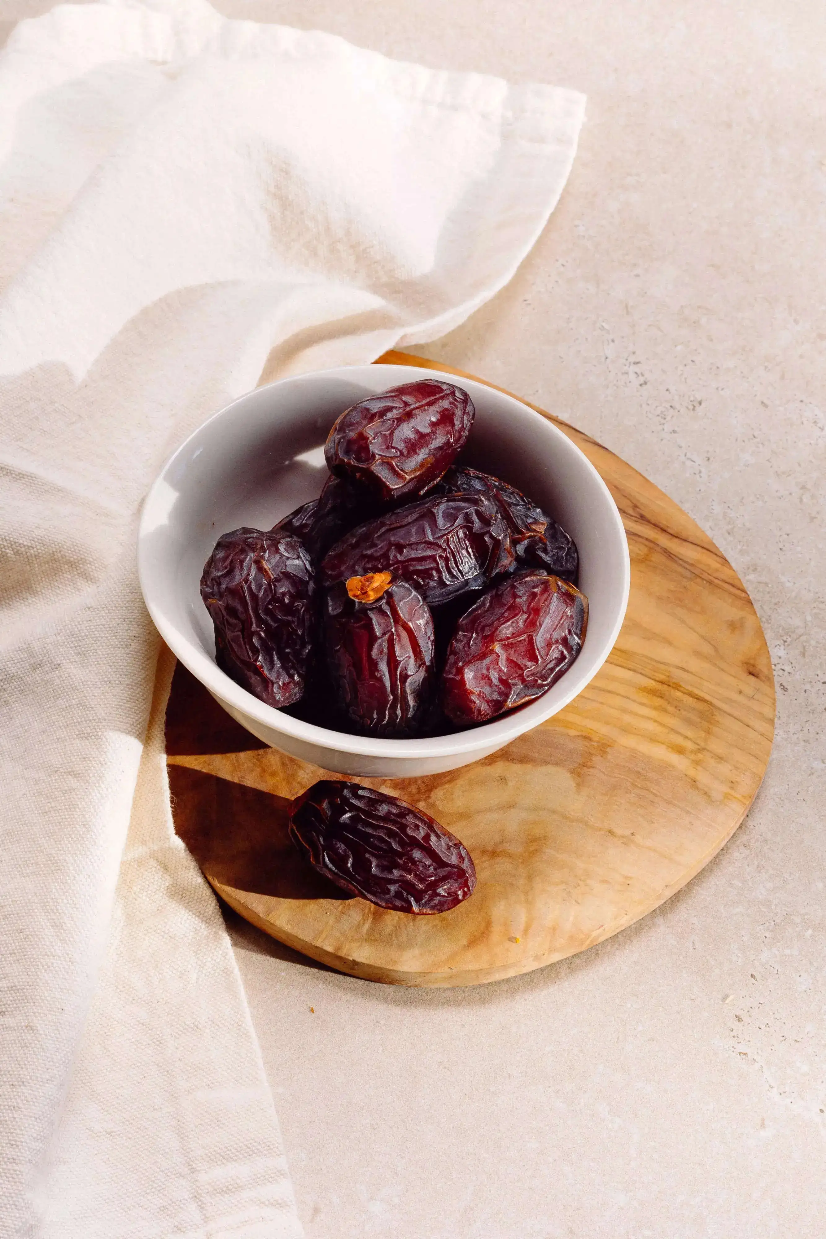 Dates in a white ceramic bowl